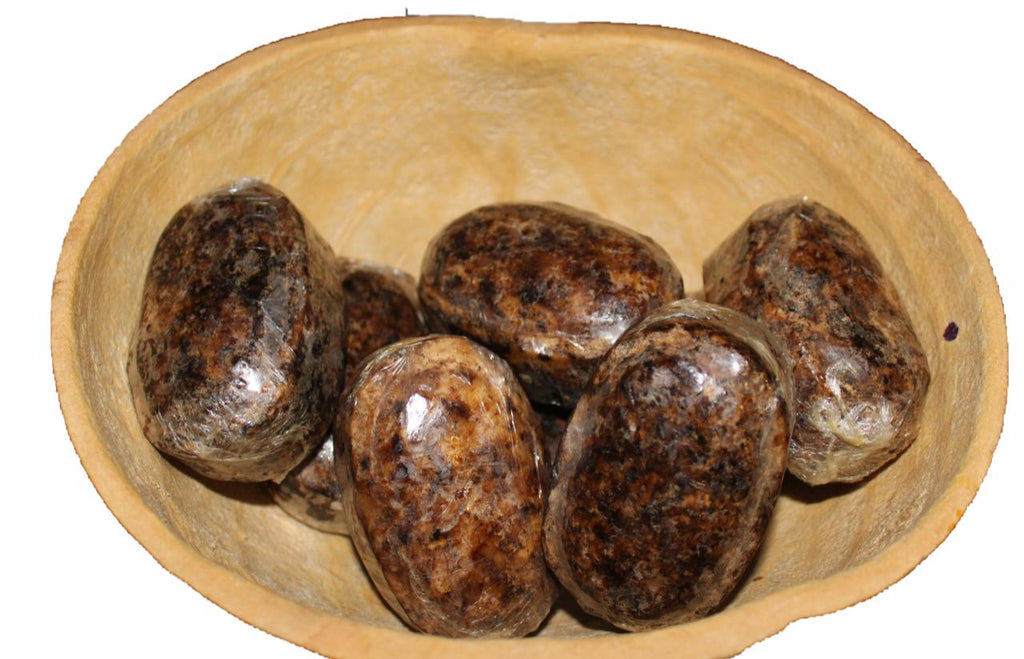 African black soap ovals in a calabash bowl