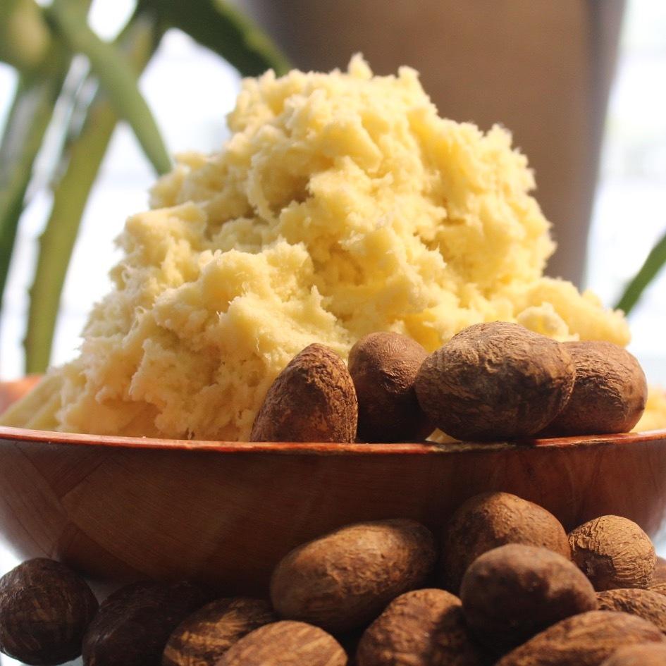 A bowl of rich, creamy raw unrefined shea butter, perfect for use in skin and hair care products